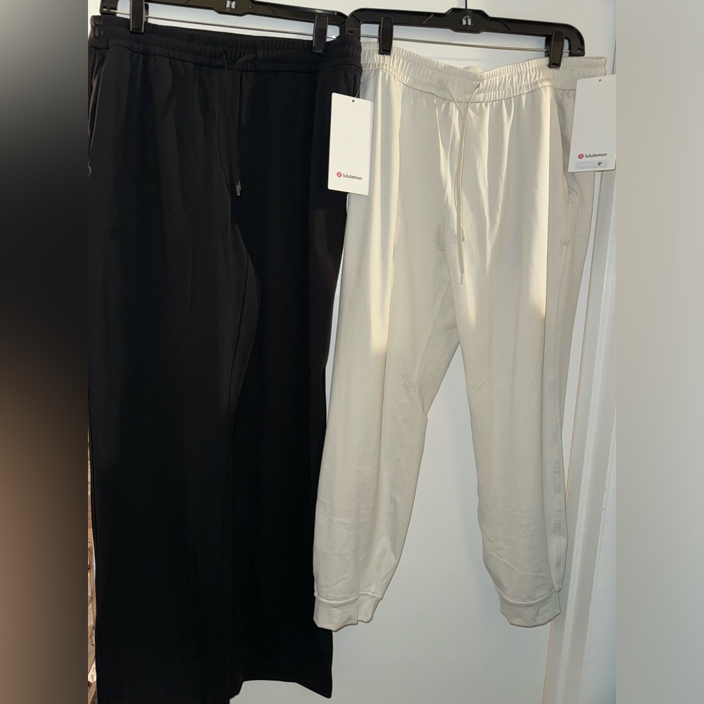 SET OF 2 pairs of Lululemon pants ! NWT cream ones are size 8 & black are size M